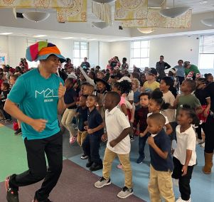  Coach Larry Calhoun dances and exercises with students
